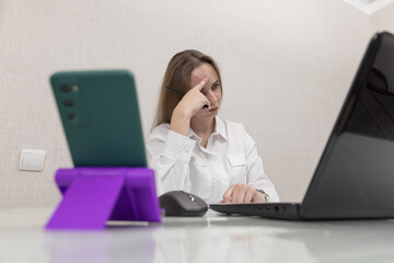Female person office worker or freelancer works in office or at home at computer. Business woman concentration look in laptop screen, she's not doing very well at work. People thought while working.
