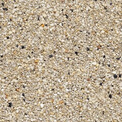 Naklejka premium Close-up of sandy beach surface with multicolored grains