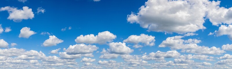 Cumulus clouds against blue sky, Marion County, Illinois.