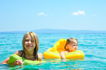 happy parent with child at sea in greece