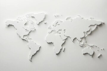 A paper map of the world cut out into puzzle pieces, ideal for educational or decorative purposes