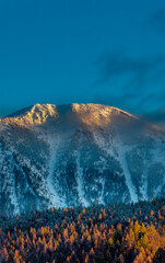 Strawberry Mountain at days last light in winter in Flathead National Forest Montana, USA.