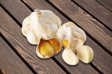 Garlic cloves on wooden table.