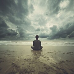 Contemplative solitude by the ocean dramatic skies tranquil beach low angle self-reflection