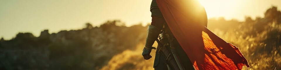 A man wearing a red cape stands in an open field, looking out at the horizon