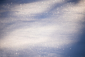 Snow surface with early sunlight and shadow
