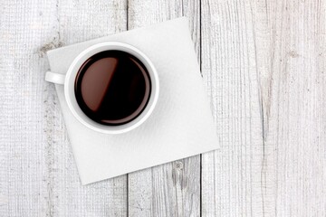 Tasty hot Espresso coffee in cup on desk