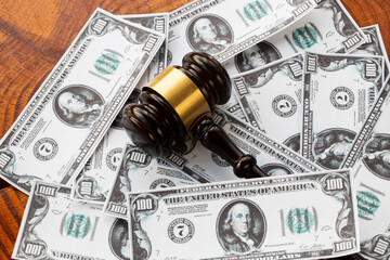 Labor law concept and mallet, background with money Dollar
