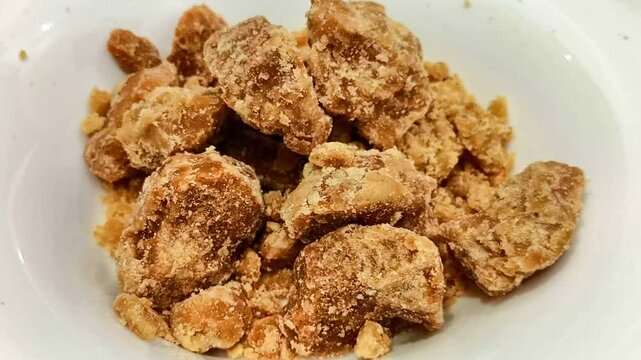 jaggery from sugarcane on a plate rotating