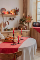Red candle on a festive Christmas table