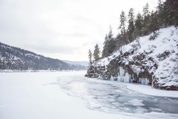 Winter landscape with frozen river.