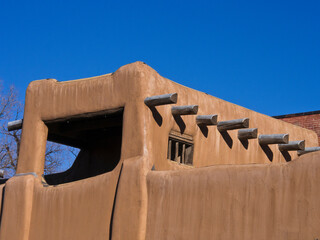 USA, New Mexico, Sante Fe. Southwest architecture, part of a earth colored adobe house in Santa Fe.