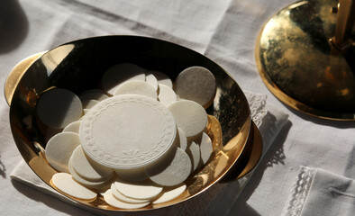 hosts during the catholic mass, symbolizing the body of christ offered to the faithful