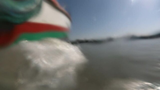 Slow motion GoPro shot of wooden tourist boat sailing on Lake Tana in Ethiopia
