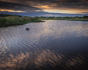 USA, New Jersey, Cape May National Seashore. Sunrise on marsh wetland.