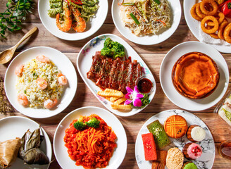 Grilled Pork Ribs, Steamed Zongzi, Shrimp pesto pasta, shrimp fried rice, Meat Spaghetti with tomato sauce, Fried Rice Noodles, shredded pork, crispy onion rings, french pastries, top view food