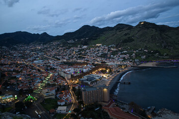 Aerial view of Machico in Portugal island of Madeira, New Year celebration lights all around the town