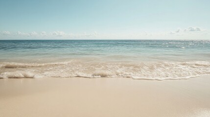 Fototapeta premium Calm ocean waves on sandy beach, sunny sky; travel poster