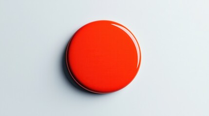 Red circular object on a light background.