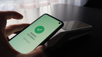 Contactless payment in Euro performed by mobile phone on Android SmartPOS terminal