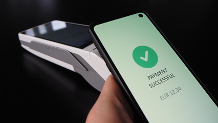 Contactless payment in Euro performed by mobile phone on Android SmartPOS terminal