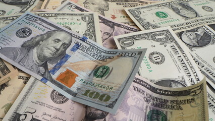 Pile of US dollars banknotes in chaotic arrangement