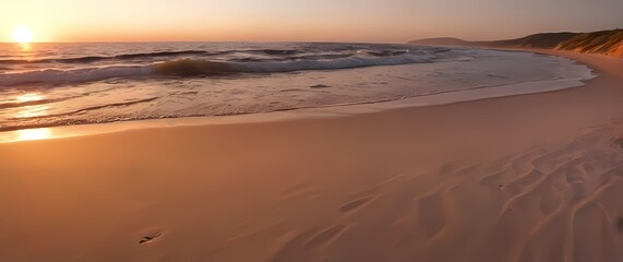 Picturesque scene of a quiet beach with soft sand and gentle waves at sunset