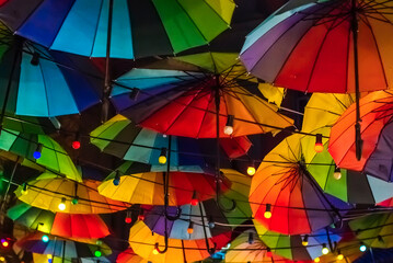 Fototapeta premium Colorful background of floating umbrellas