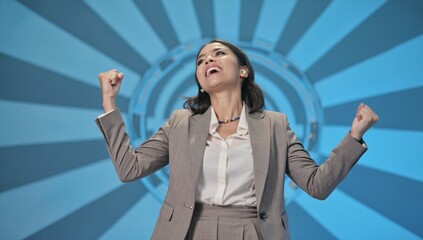 Smiling and excited young woman showing happiness and success. Joyful young female on blue background