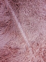 Close up of a pink artificial rose fur