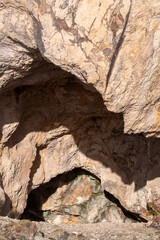 Gateway to the Unknown: Cave Entrance and Rock Formations