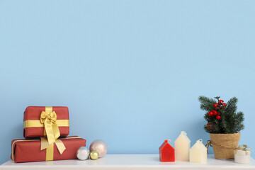 Mantelpiece decorated for Christmas with candles and gifts