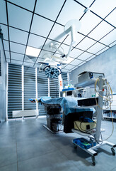 Modern surgical room setup. Surgical room featuring advanced medical equipment and bright lighting, prepared for operations during the day.