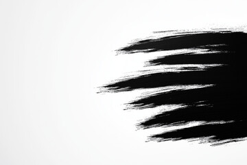 Obraz premium Dynamische, schwarze Pinselstriche auf weißem Hintergrund