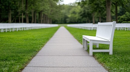Fototapeta premium Serene Outdoor Scene with White Benches and Lush Green Pathway Surrounded by Nature's Beauty