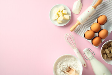 Baking ingredients and tools on a pink background: butter, eggs, flour, sugar, milk, whisk, rolling pin, and spatula. Flat lay, top view, copy space