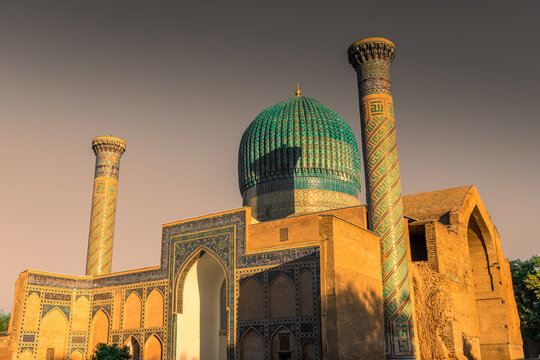 Gate of Amir Temur Gur e Amir Mosque in Samarkand at sunset, Uzbekistan