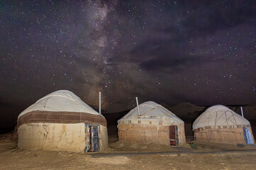 Amazing milky way and starry night over a yurt camp in the Aral Lake desert,  Uzbekistan