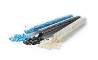 Colorful plastic granules in test tubes isolated on white