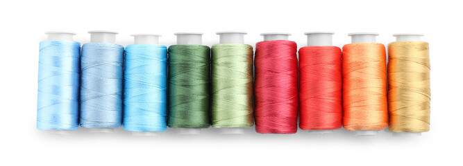 Spools of bright sewing threads isolated on white, top view