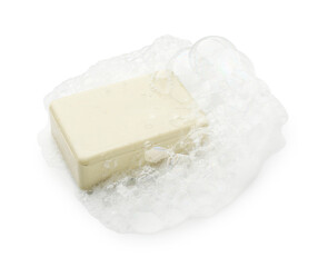 Bar soap with foam on white background