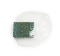 Blue soap with foam on white background, top view