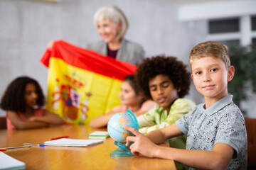 Kids learning together about spain in geography class
