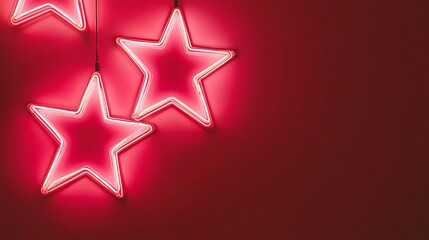 Obraz premium Pink neon stars, red wall, minimal