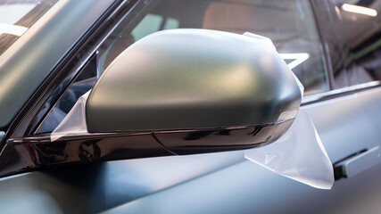 The process of installing PPF matte film on the side of the car. PPF is a polyurethane, protective...
