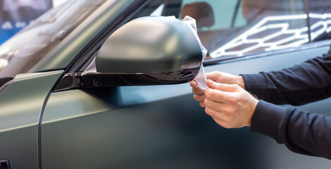 The process of installing PPF matte film on the side of the car. PPF is a polyurethane, protective...