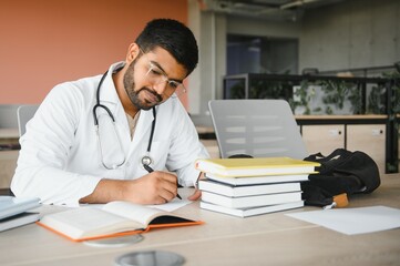 multiracial South Asian medical students with a medical court and stethoscope. medical student life