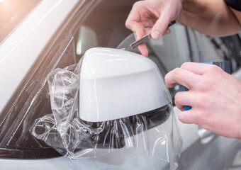 The process of installing PPF matte film on the side of the car. PPF is a polyurethane, protective...