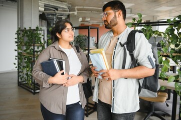 Cheerful Indian asian young college students or friends