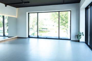 Modern apartment with big windows empty interior space designed in minimalism